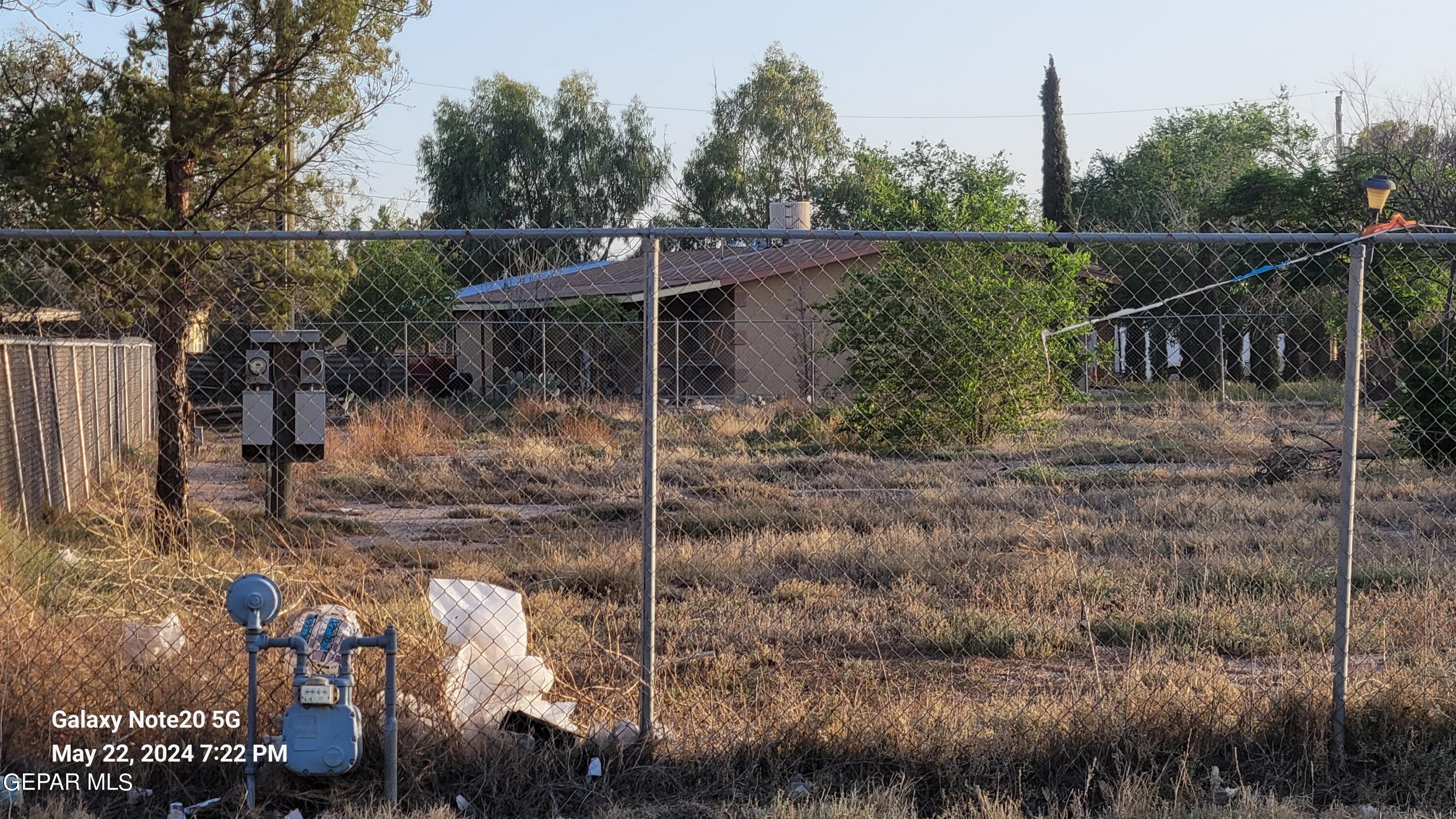 12940 Cuadrilla Road San Elizario, TX 79849 - Photo 7 of 22 a backyard of a house with lots of green space
