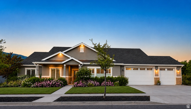 283 South Buffalo Ranch Road Farmington, UT 84025 - Photo 1 of 10 Exterior featuring a stucco finish, stone accents, and a dark shingle roof