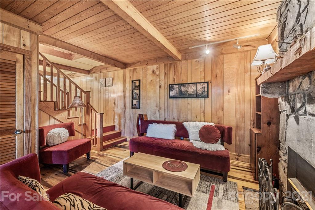 602 Quail Cove Road Clyde, NC 28721 - Photo 33 of 48 a living room with furniture and a wooden floor