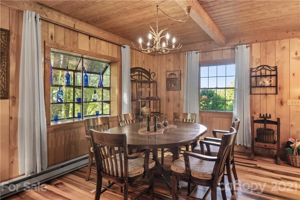 602 Quail Cove Road Clyde, NC 28721 - Photo 36 of 48 a view of a dining room with furniture window and outside view