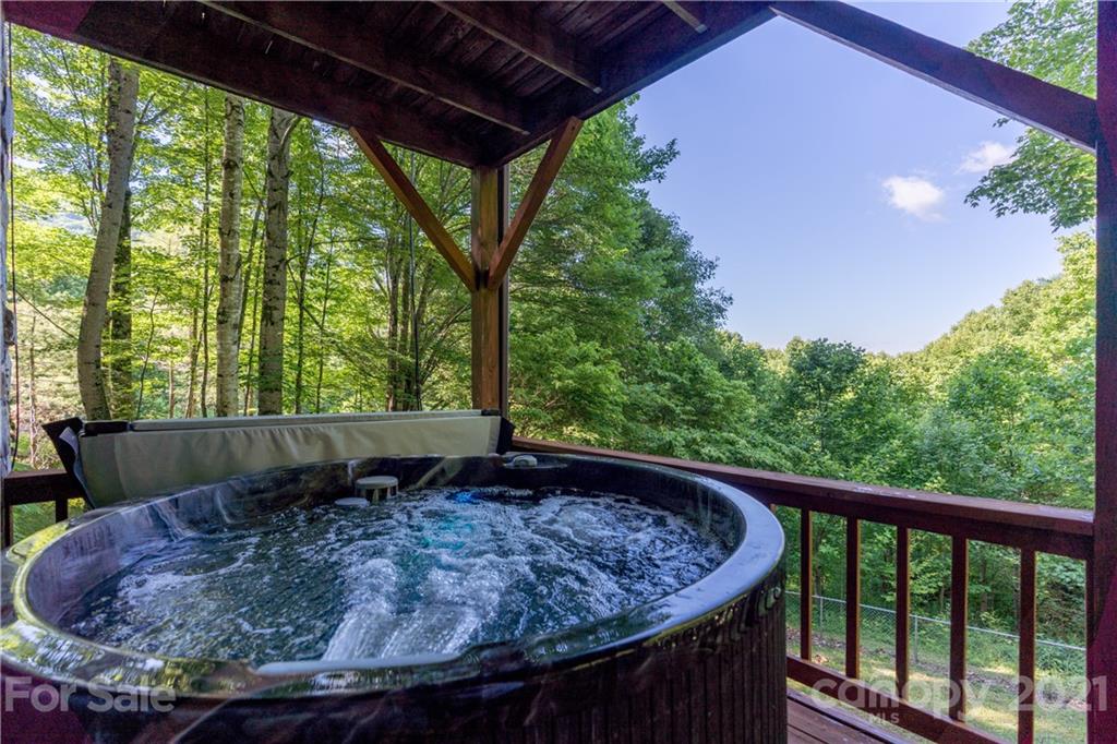 602 Quail Cove Road Clyde, NC 28721 - Photo 40 of 48 a view of a swimming pool with a patio