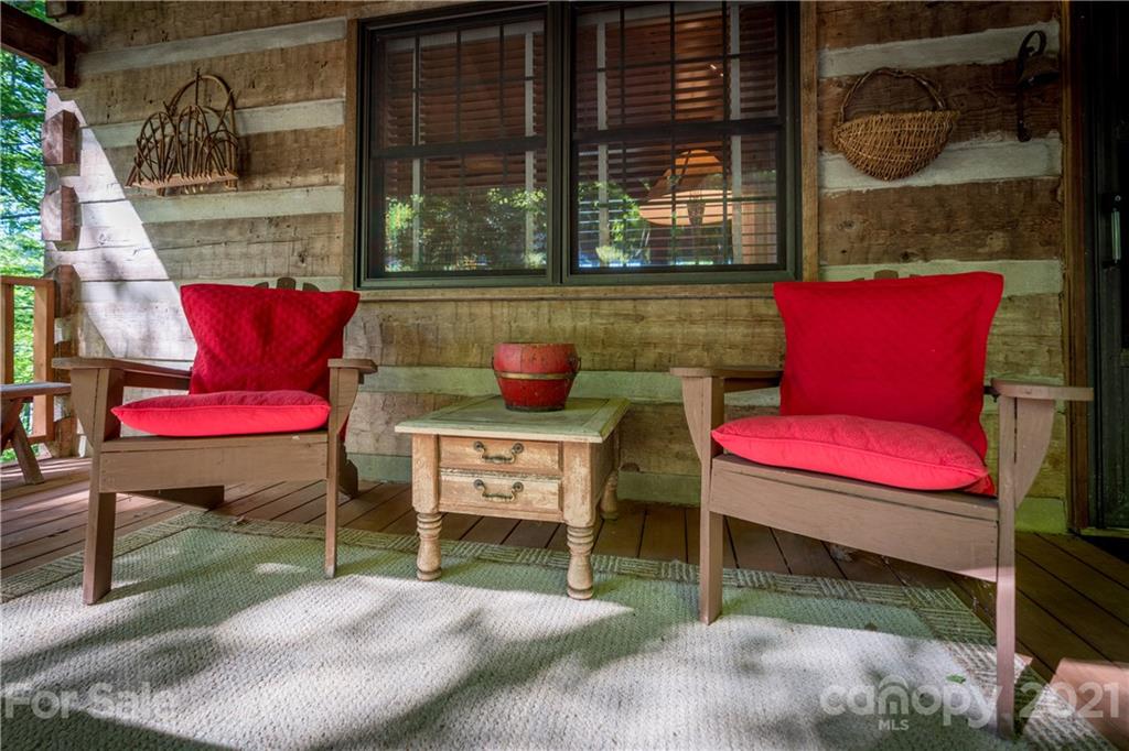 602 Quail Cove Road Clyde, NC 28721 - Photo 44 of 48 a view of a two chairs in the patio