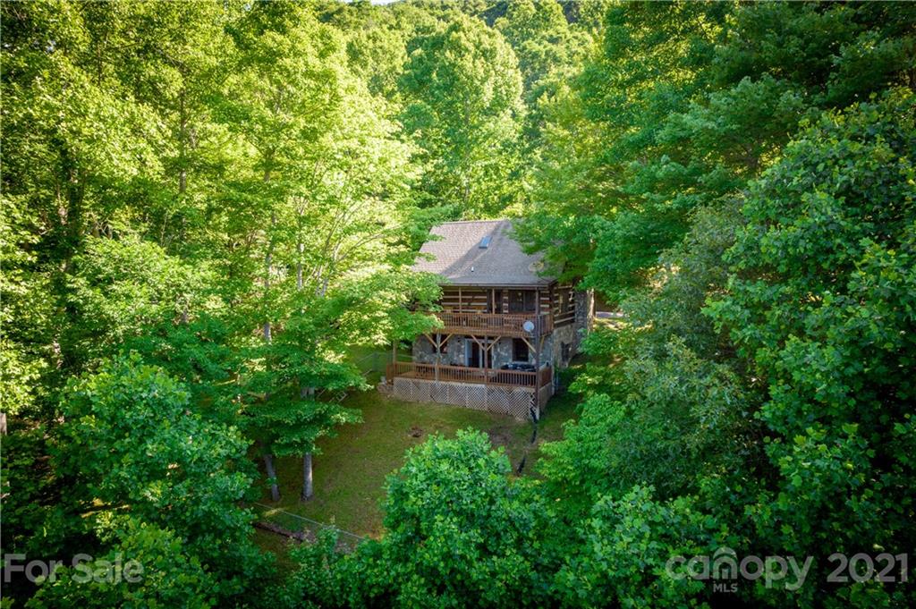 602 Quail Cove Road Clyde, NC 28721 - Photo 48 of 48 a view of a house with a yard