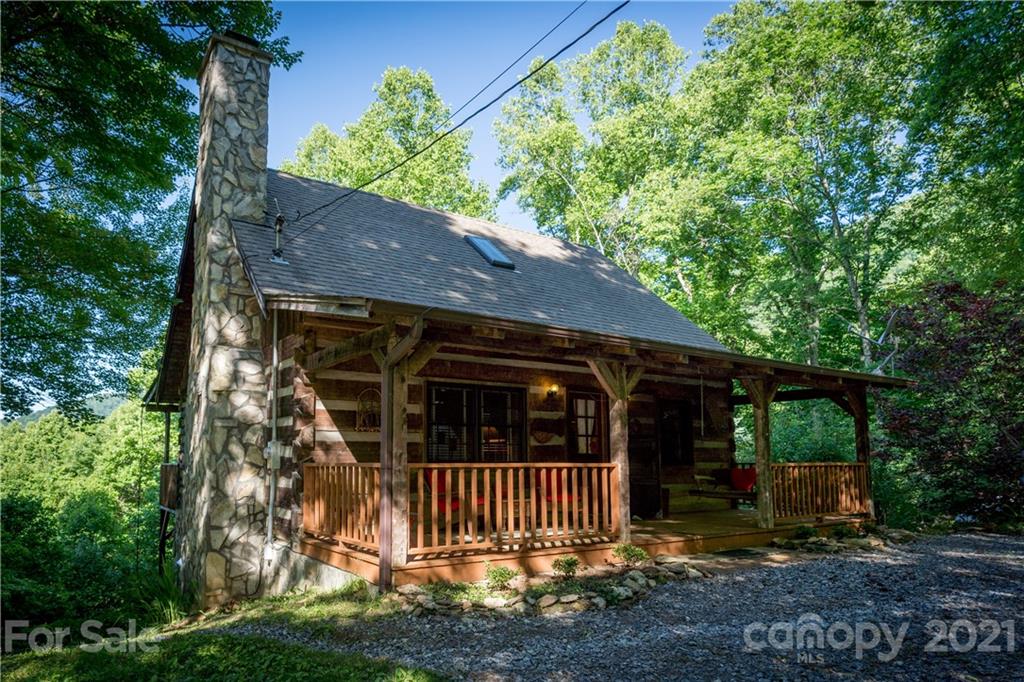 602 Quail Cove Road Clyde, NC 28721 - Photo 6 of 48 a view of a house with a yard