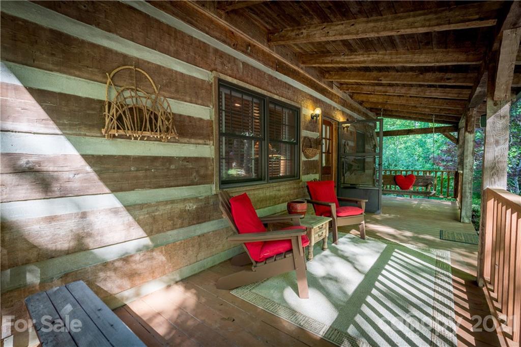 602 Quail Cove Road Clyde, NC 28721 - Photo 9 of 48 a view of porch with a bench