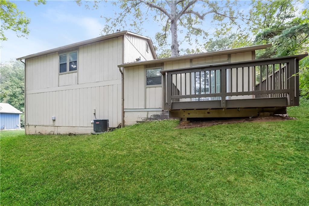3352 Herrenhut Road Lithonia, GA 30038 - Photo 24 of 27 a view of a backyard with a garden and deck