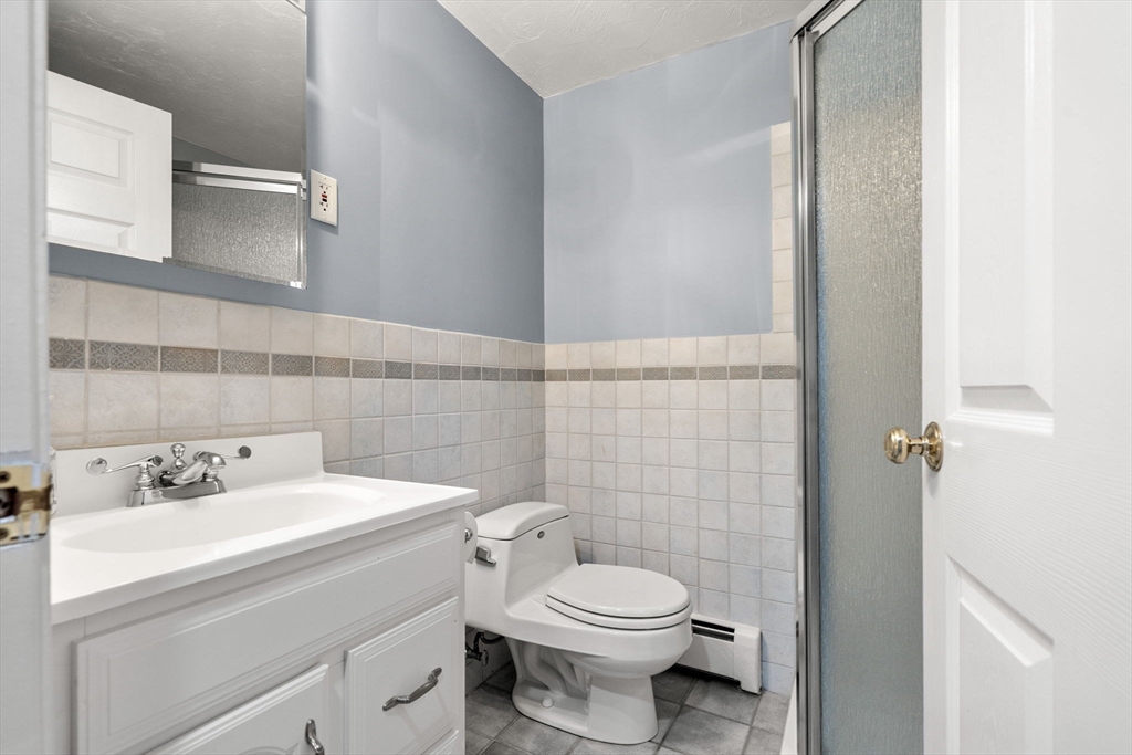 152 Gay Road Groton, MA 01450 - Photo 28 of 38 a bathroom with a sink a toilet and a mirror