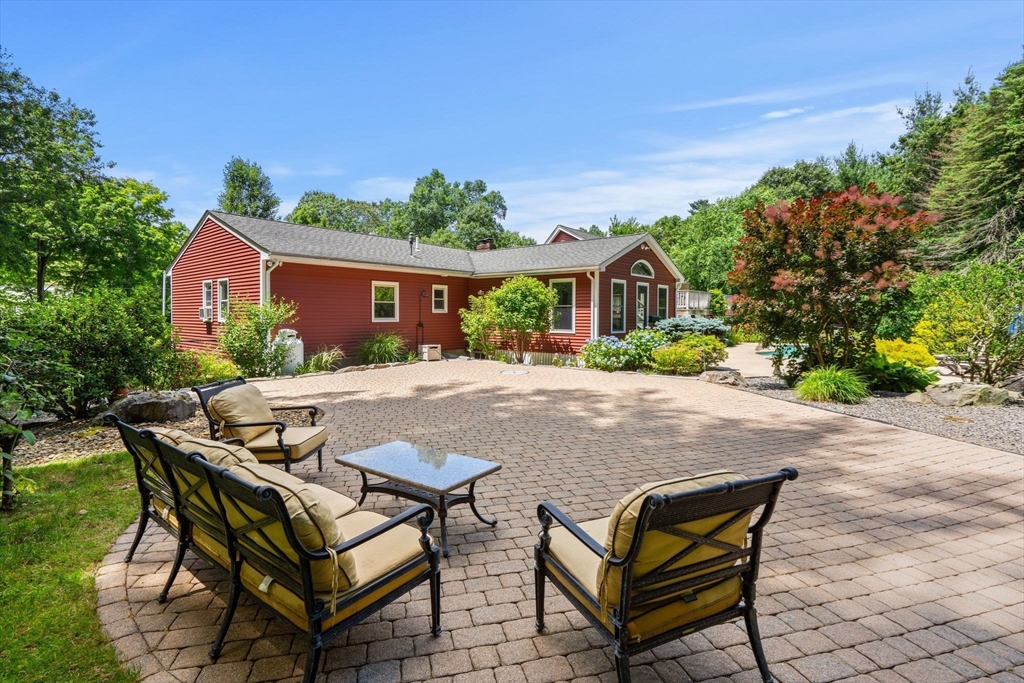 152 Gay Road Groton, MA 01450 - Photo 35 of 38 a view of a house with backyard and sitting area