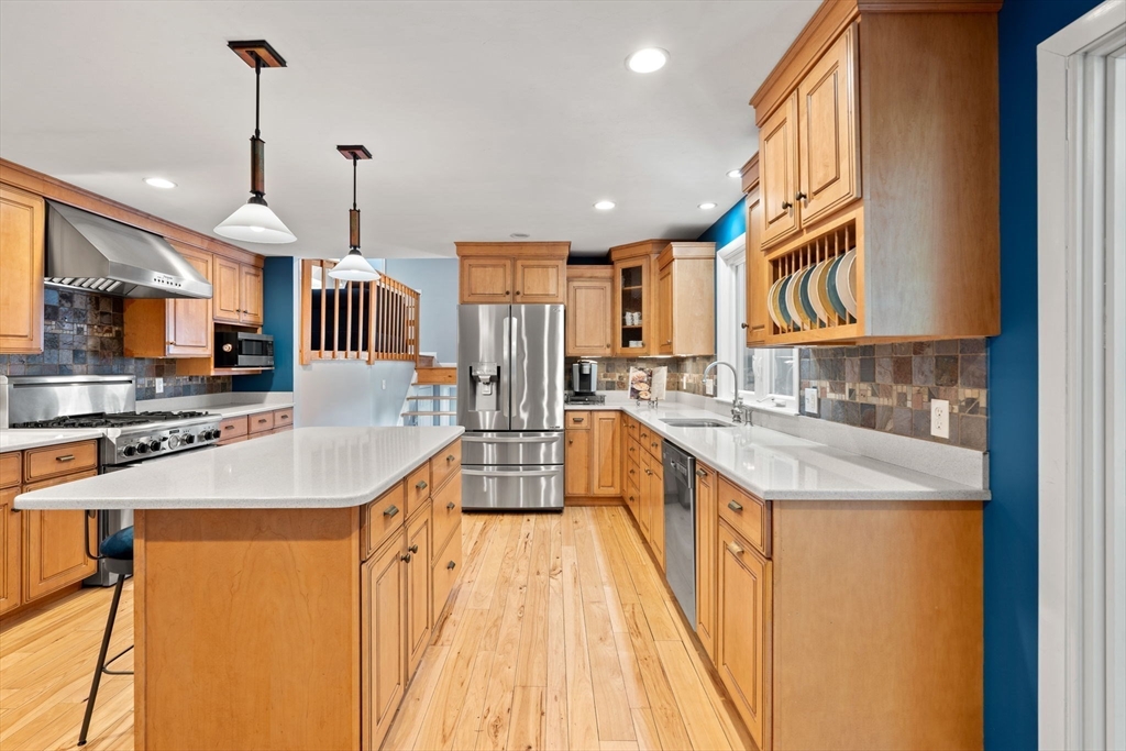 152 Gay Road Groton, MA 01450 - Photo 4 of 38 a kitchen with stainless steel appliances granite countertop sink stove and cabinets