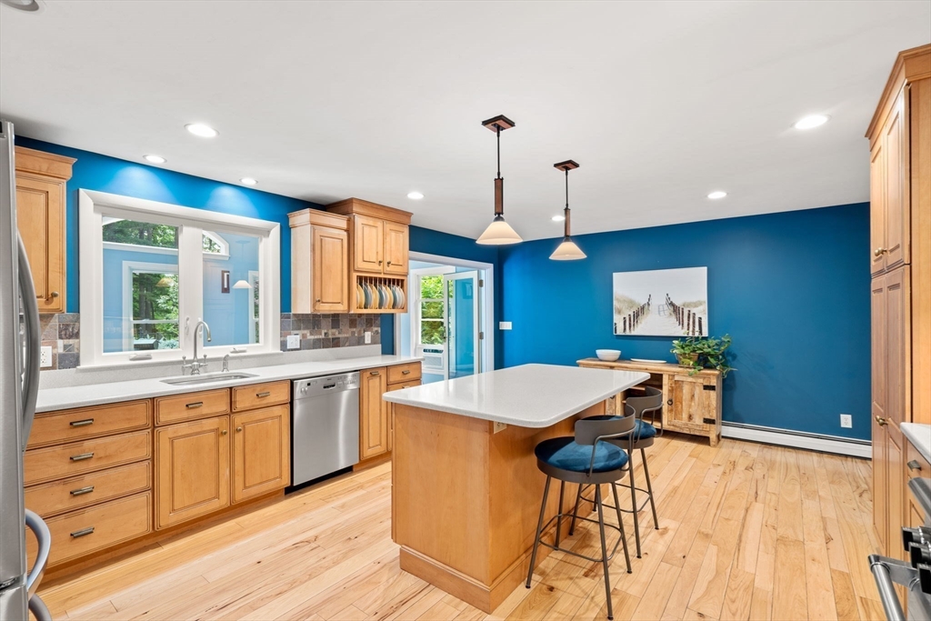 152 Gay Road Groton, MA 01450 - Photo 5 of 38 a open kitchen with a table and chairs in it