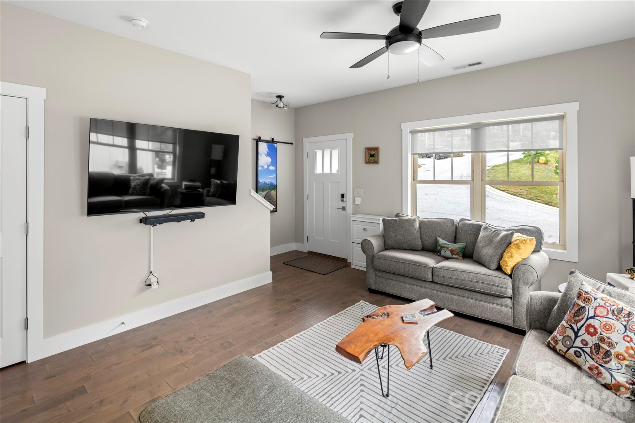 52 Wheeler Road Weaverville, NC 28787 - Photo 5 of 21 a living room with furniture and a flat screen tv