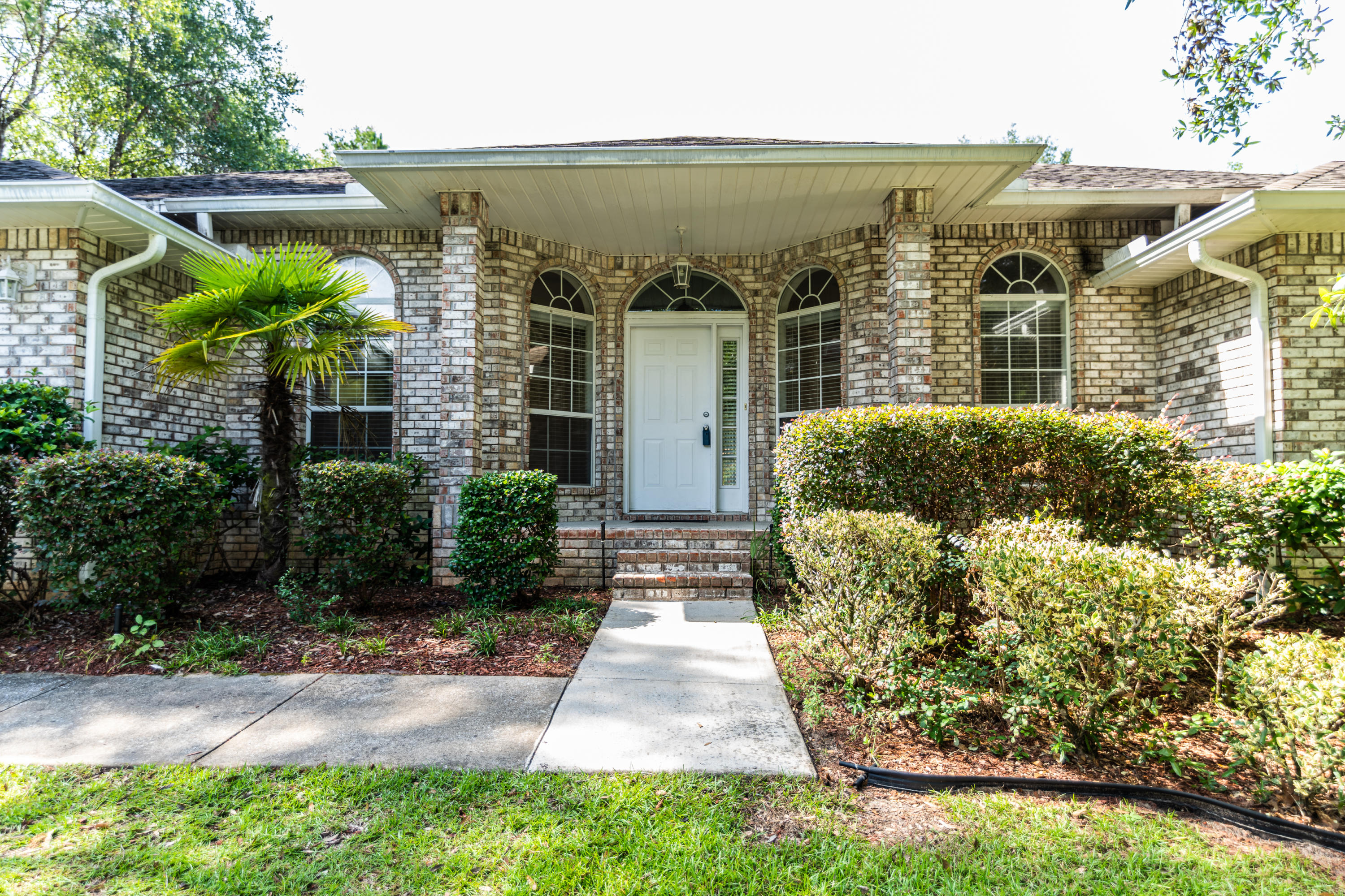 231 Foxchase Way Crestview, FL 32536 - Photo 1 of 30 a front view of a house with a yard