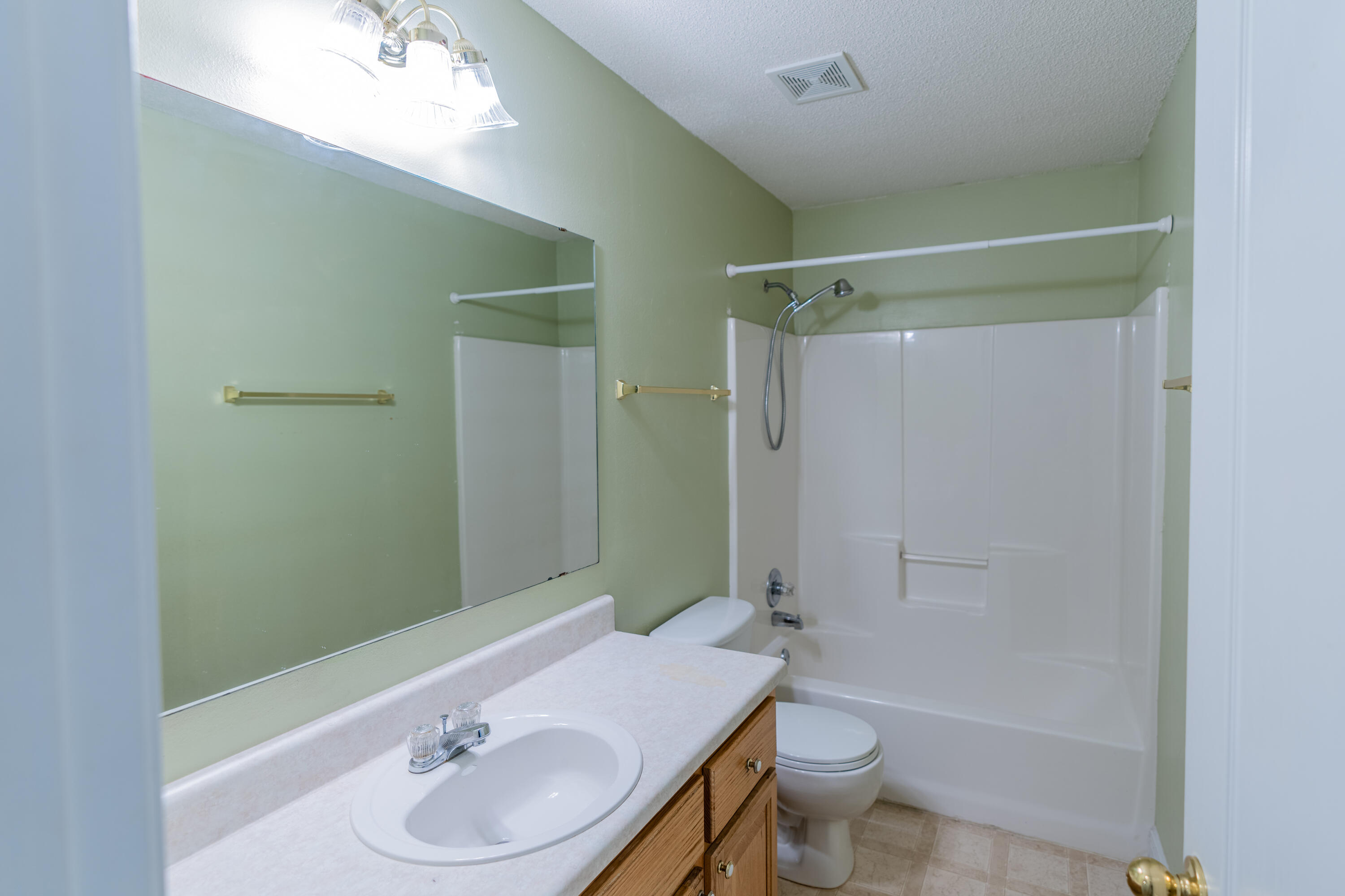 231 Foxchase Way Crestview, FL 32536 - Photo 11 of 30 a bathroom with a granite countertop sink toilet and shower
