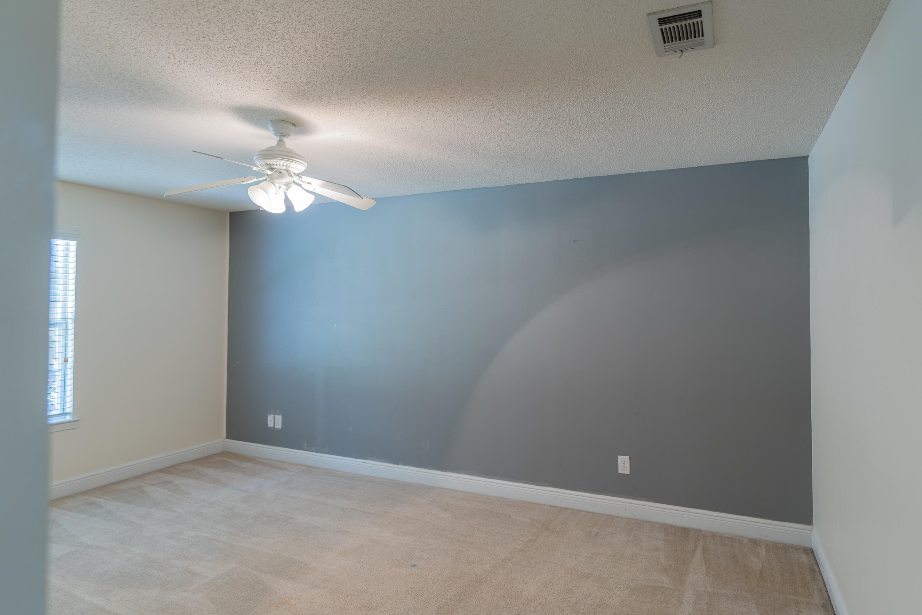231 Foxchase Way Crestview, FL 32536 - Photo 14 of 30 an empty room with a fan & a window