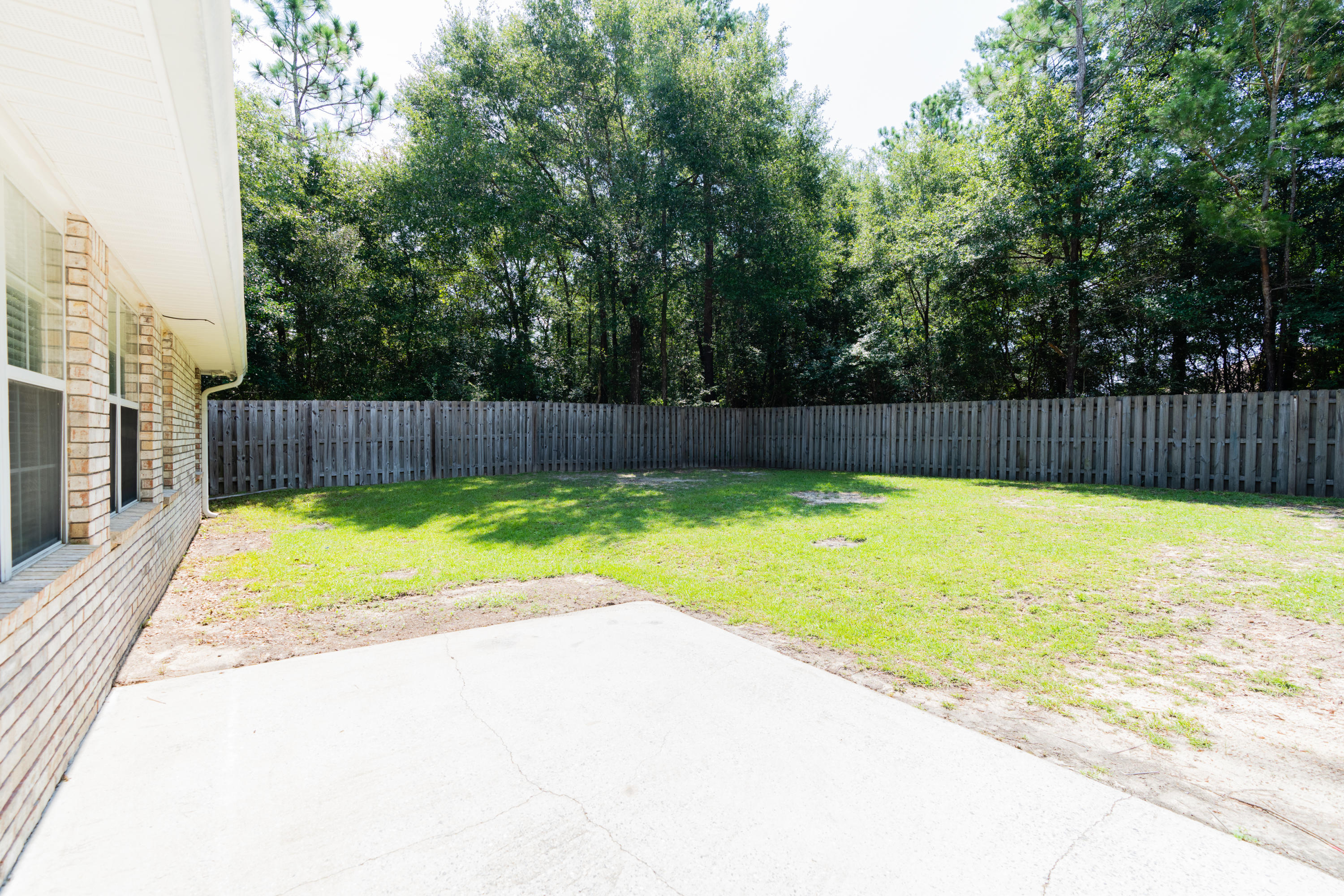 231 Foxchase Way Crestview, FL 32536 - Photo 28 of 30 a view of a backyard with a large area of the house