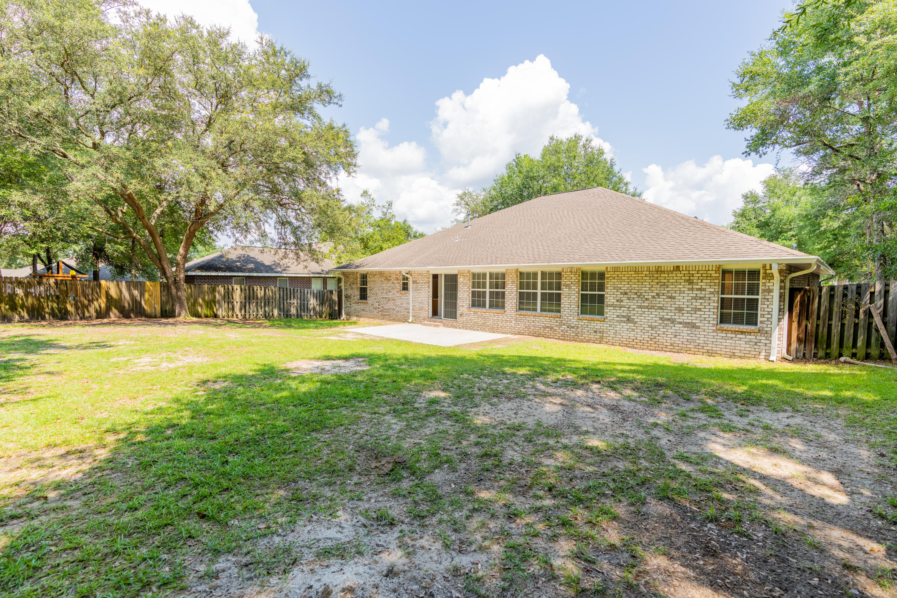 231 Foxchase Way Crestview, FL 32536 - Photo 29 of 30 a front view of a house with a garden