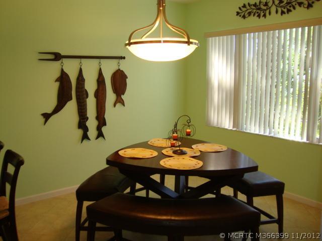 Dining Room. The dining area is just off of the kitchen with a sliding door to the porch.