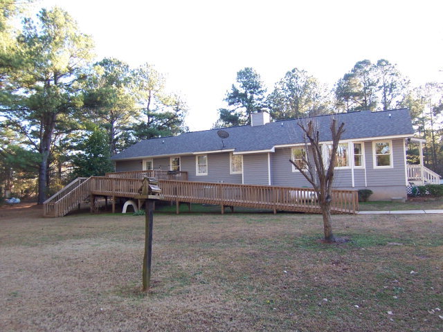 69 Lentz Road Macon, GA 31220 - Photo 12 of 12 a view of a house with a yard and roof