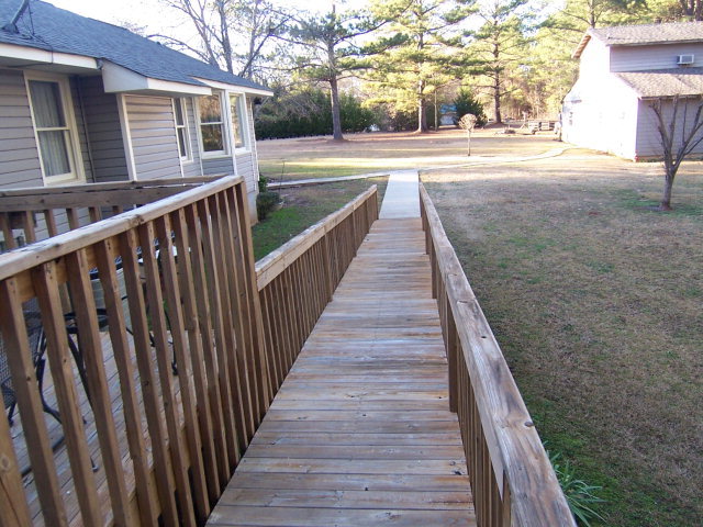 69 Lentz Road Macon, GA 31220 - Photo 6 of 12 a view of a balcony with wooden floor and fence