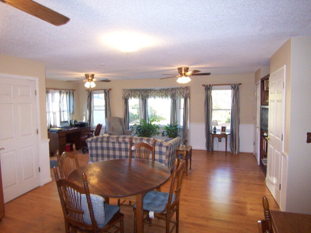 69 Lentz Road Macon, GA 31220 - Photo 8 of 12 a view of a a dining room with furniture window and wooden floor