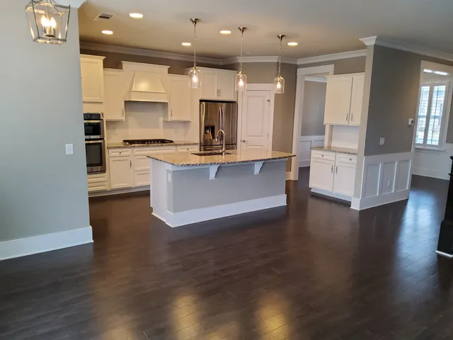 a large kitchen with stainless steel appliances