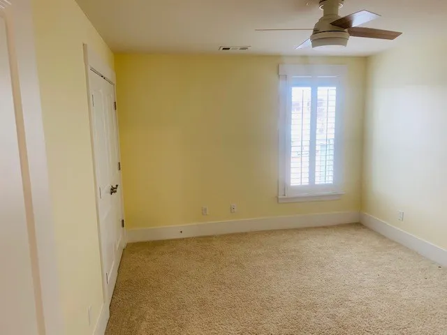 wooden floor and window in an empty room
