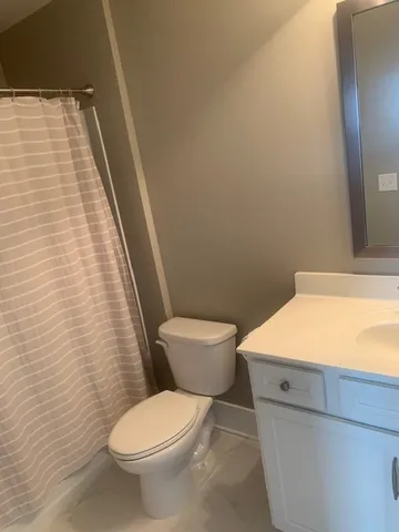 a bathroom with a toilet and a sink