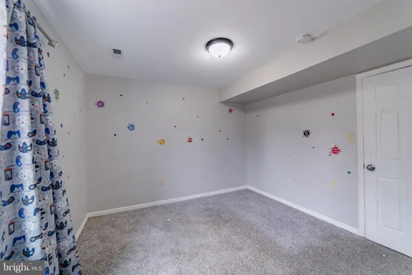 a bathroom with a sink a toilet a mirror and vanity