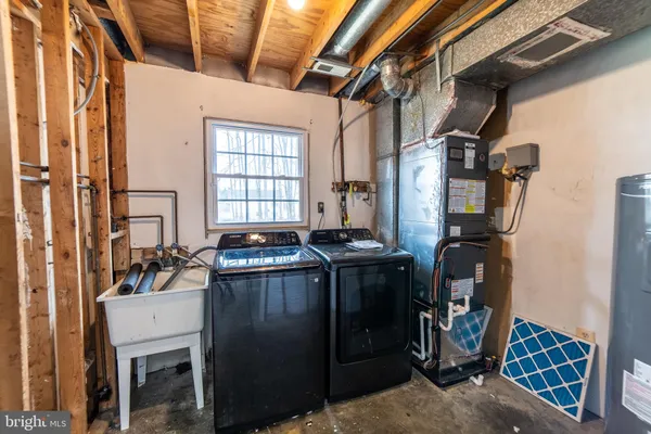 a white toilet sitting next to a bathroom sink