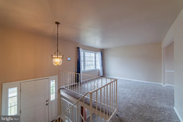 a view of an empty room with windows