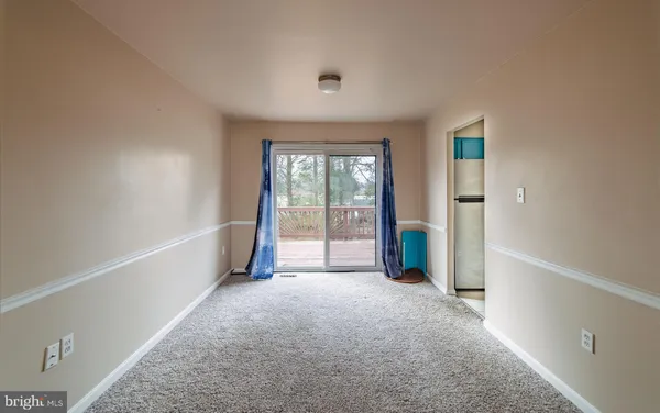 a view of a room with large windows