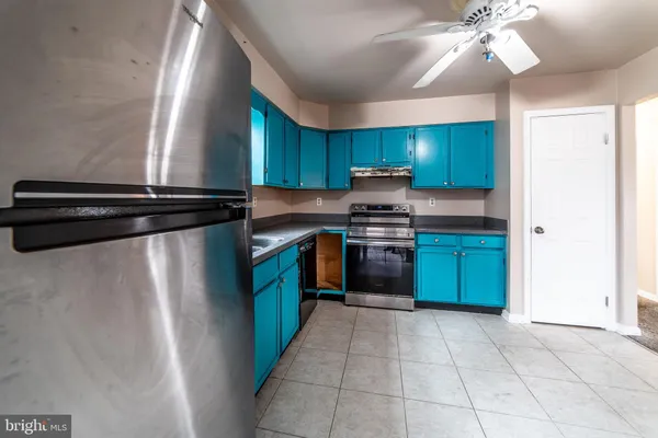 a kitchen with cabinets a sink and a stove