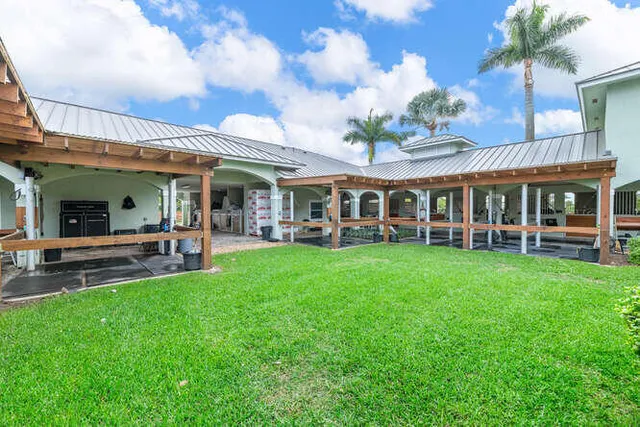 a view of a house with a backyard porch and patio