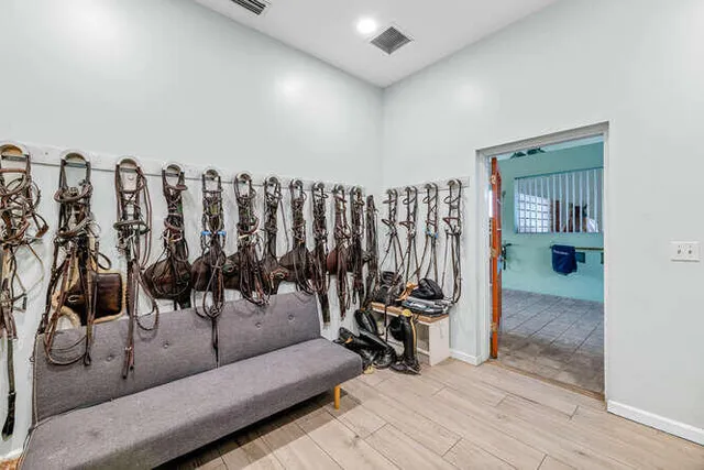 a view of a house with porch and garden