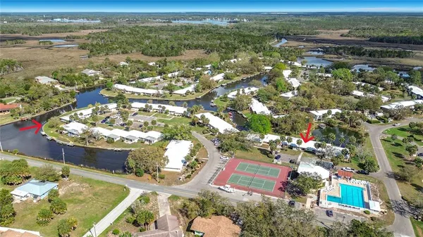 an aerial view of residential houses with outdoor space
