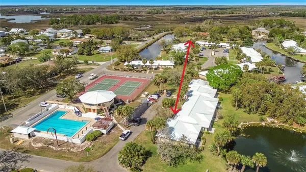 an aerial view of residential houses with outdoor space