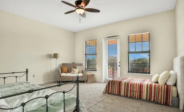 a bedroom with a bed and glass window