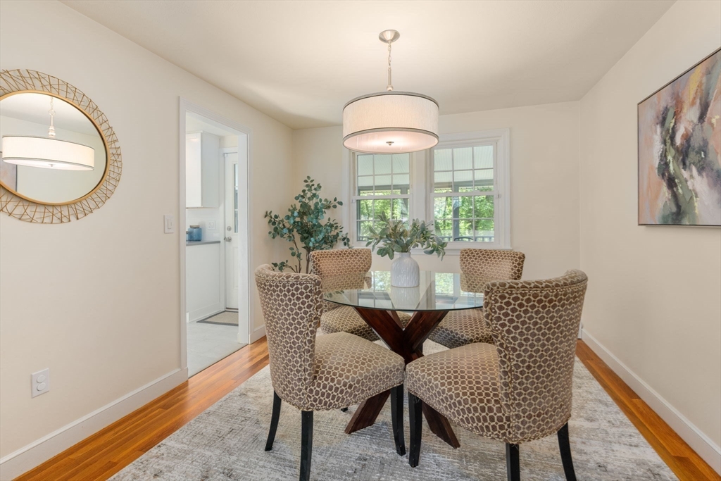 11 Longmeadow Road Medfield, MA 02052 - Photo 7 of 39 a view of a dining room with furniture wooden floor and chandelier