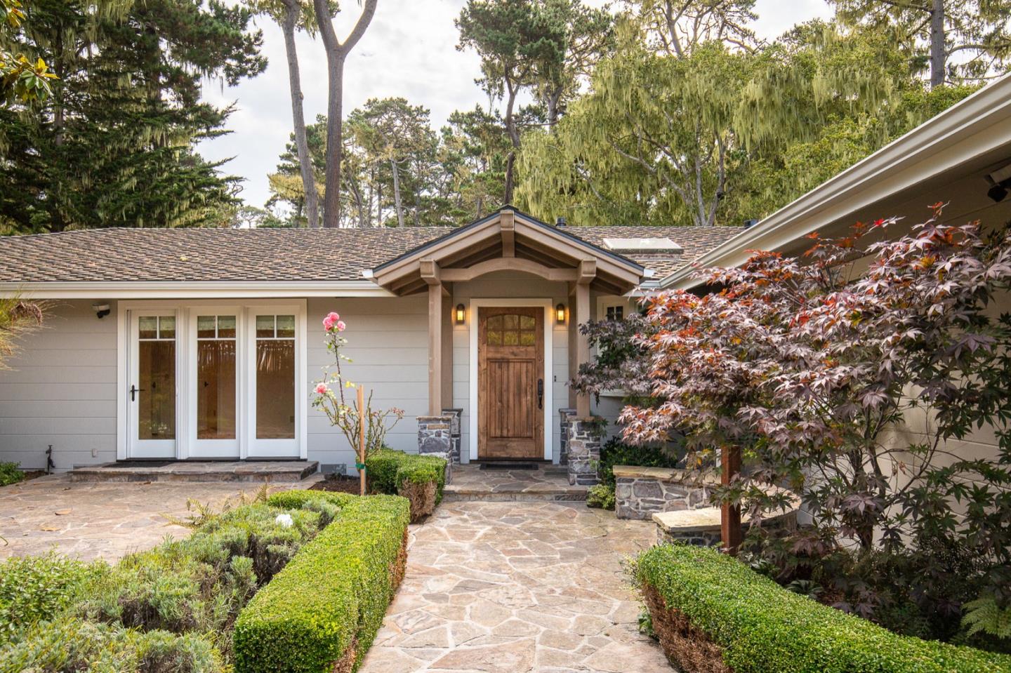 a front view of a house with garden