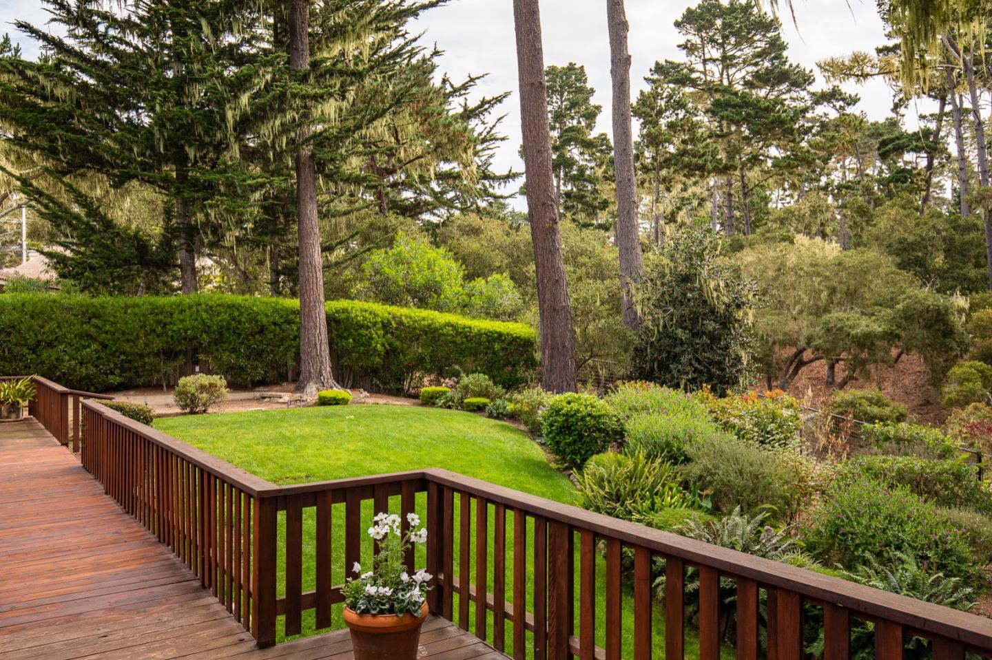 3115 Middle Ranch Road Pebble Beach, CA 93953 - Photo 11 of 19 a balcony with wooden floor and outdoor seating