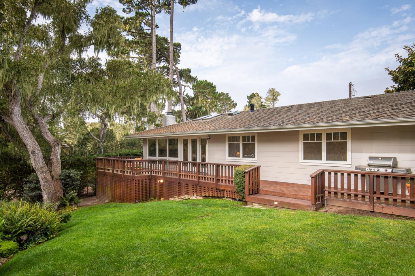 3115 Middle Ranch Road Pebble Beach, CA 93953 - Photo 13 of 19 a view of a house with a backyard and a garden