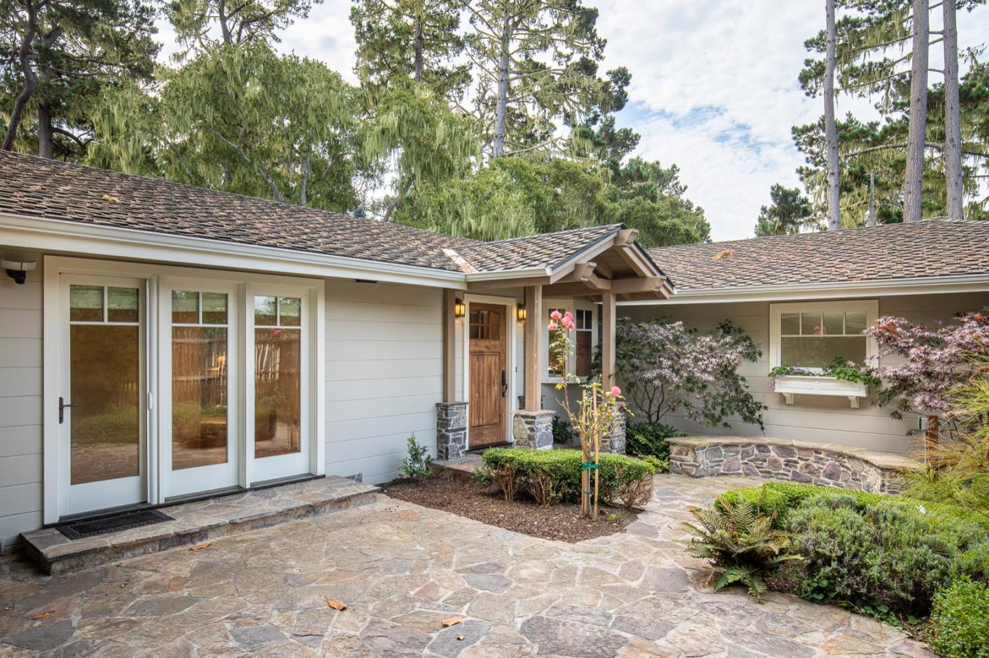 3115 Middle Ranch Road Pebble Beach, CA 93953 - Photo 2 of 19 a view of a house with backyard and garden