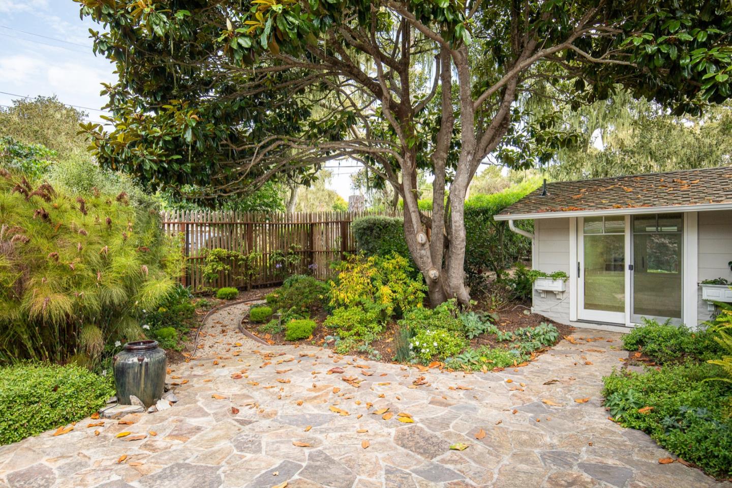 3115 Middle Ranch Road Pebble Beach, CA 93953 - Photo 4 of 19 a front view of a house with a garden