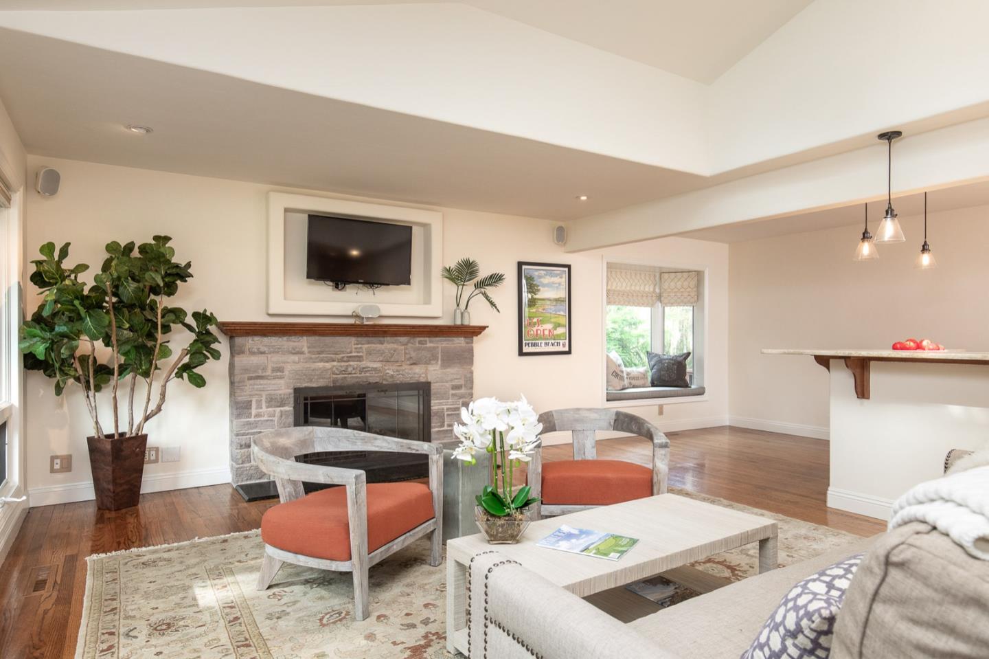 3115 Middle Ranch Road Pebble Beach, CA 93953 - Photo 6 of 19 a living room with furniture a flat screen tv and a fireplace
