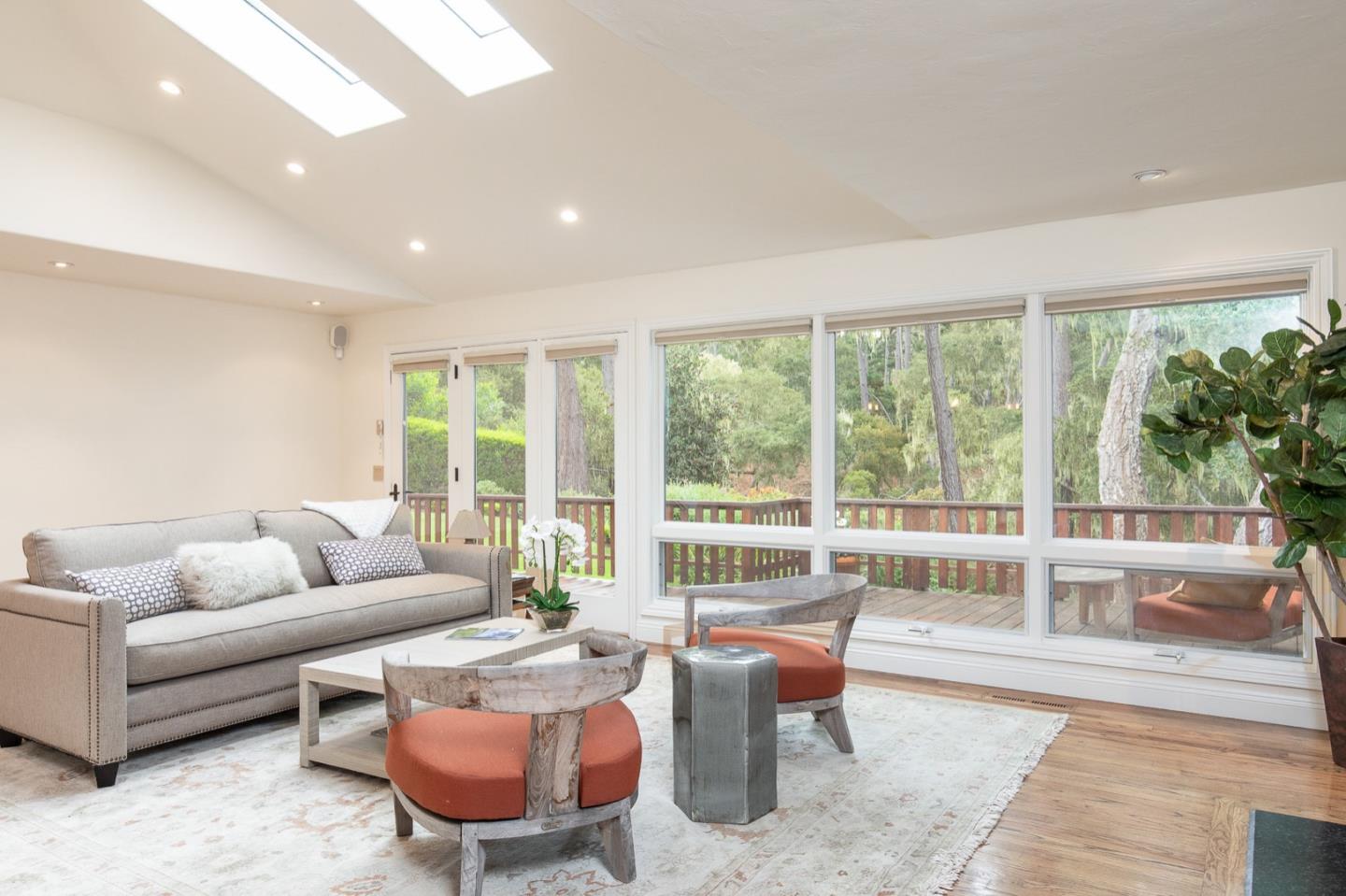 3115 Middle Ranch Road Pebble Beach, CA 93953 - Photo 7 of 19 a living room with furniture and a floor to ceiling window