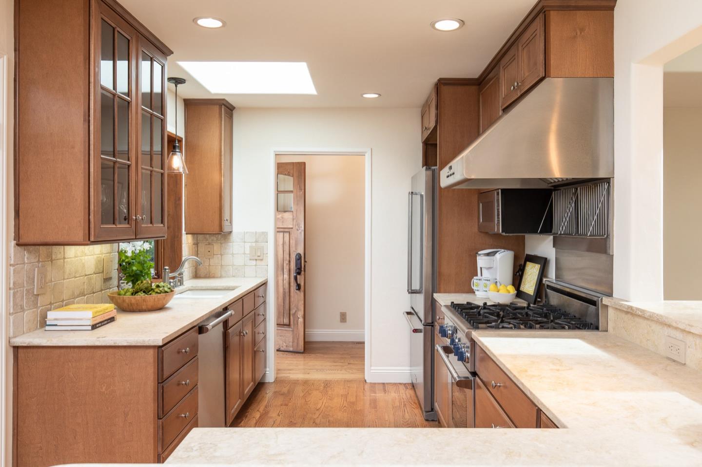 3115 Middle Ranch Road Pebble Beach, CA 93953 - Photo 8 of 19 a kitchen with stainless steel appliances kitchen island granite countertop a sink stove and refrigerator