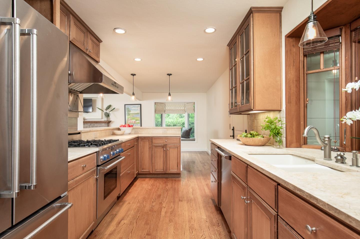 3115 Middle Ranch Road Pebble Beach, CA 93953 - Photo 9 of 19 a kitchen with a sink stove and refrigerator