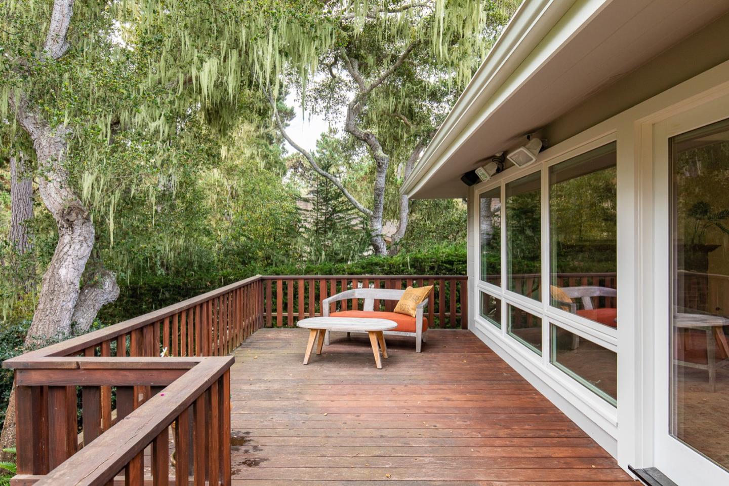 3115 Middle Ranch Road Pebble Beach, CA 93953 - Photo 10 of 19 a balcony with wooden floor and furniture