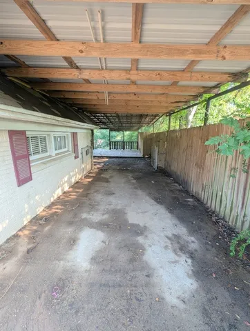 a view of a shaded area in a backyard