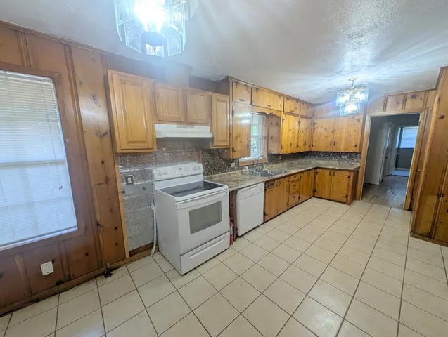 a kitchen with a cabinets and appliances